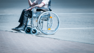 man in a wheelchair after suffering a severe injury