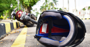 Motorcycle helmet on the ground after an accident in Hartford, with the motorcycle in the background