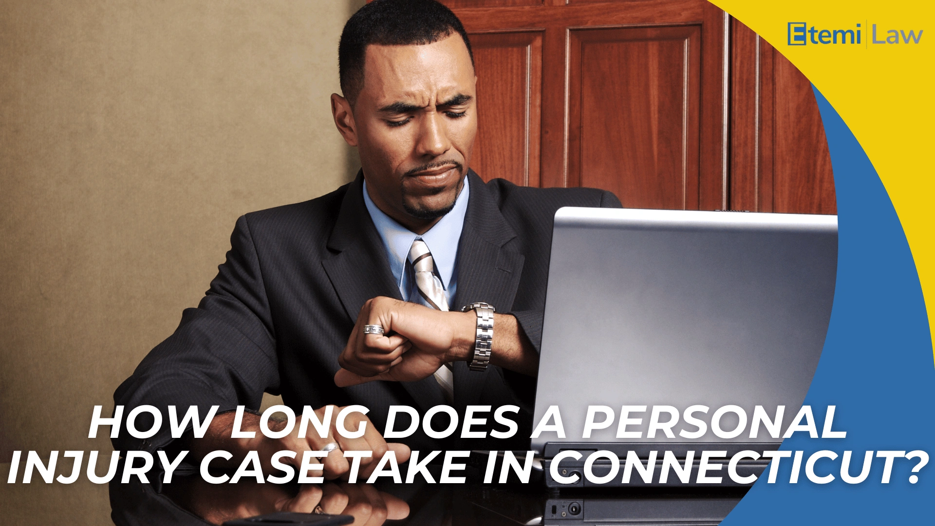 Business professional checking watch at desk conveys timeline concerns for Connecticut personal injury cases