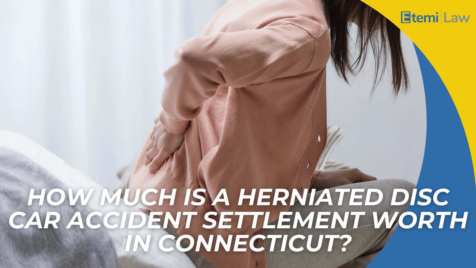 Person holding lower back in pain highlights herniated disc injury and settlement value in Connecticut