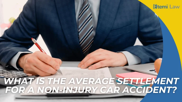 Person in suit signing documents at desk introducing average settlement amounts for non injury car accident claims